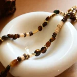 Maillard coconut shell and tiger's eye pendant necklace set